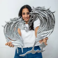 My art is about capturing emotion in physical form. Here, I'm holding the "Eternal Horses" sculptures, which are crafted from upcycled paper and embellished with rough diamonds. These pieces embody a blend of untamed strength and refined luxury, perfect for making a statement.