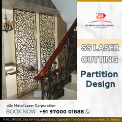 A beautiful stainless steel partition featuring a laser-cut coral or tree branch pattern. This design elegantly divides the space next to a staircase, allowing light to pass through while adding a significant decorative element with its polished, reflective finish.