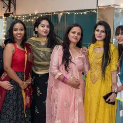Smiles and traditional wear during our studio party. I help your family and friends feel comfortable and look great, whether they are posing for a photo or performing on stage.