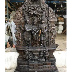 This monumental 87-inch sculpture depicts the Thirukalyana Kolam of Goddess Meenakshi. Carved in a rich, dark wood finish, the piece stands as a testament to our ability to create temple-quality art for grand spaces.