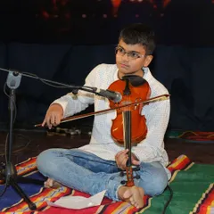 Amogh demonstrates precise fingerwork on the violin, a key aspect of our detailed instrumental training.