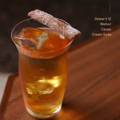 The Walnut Highball, a nutty and refreshing take on a classic. We mix Dewar's 12 with walnut, cacao, and cream soda for a truly distinctive flavour.