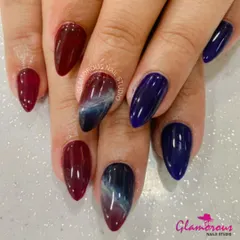 A dramatic and moody design featuring a mix of deep wine red, dark blue, and a stunning marble effect that blends the two colors with white for a cosmic feel.