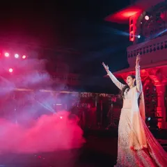 Dance is the dialogue between the body and soul. This bride's solo was a powerful expression of joy and freedom, with dramatic lighting and effects creating an unforgettable stage moment.