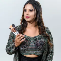 A photo of me with my essential tools, my makeup brushes, ready to create.