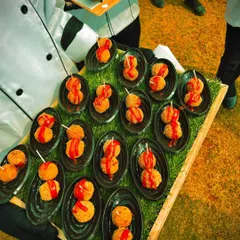 A tray of classic cheese balls, perfectly fried and ready to be served as a pass around starter. Even simple dishes are prepared with care and presented beautifully.