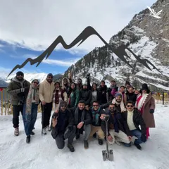 A large group photo in the snow. This is what our winter trips look like: full of fun, laughter, and lots of snow.
