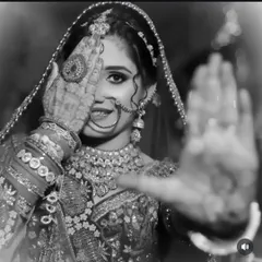 A classic black and white photo that beautifully highlights the intricate patterns of the bridal mehndi.