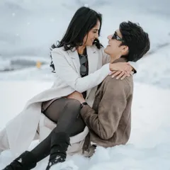 A playful moment in the snow. This candid shot from Manan and Anushi's Azerbaijan pre-wedding shoot captures their genuine smiles and the joy of being together in a winter wonderland.