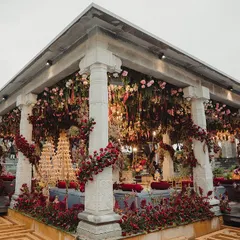 For this traditional Bunt ceremony, we used a rich, deep red floral palette to create a dramatic and opulent mandap against the backdrop of the Nandi Hills. The structure was designed to feel both grand and deeply rooted in tradition.
