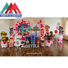 This is our full Paw Patrol birthday party theme. It includes a vibrant balloon arch, a large light-up number '5', character standees of the pups, and a personalized name sign for the birthday girl, Ashvika.