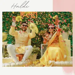 A joyous moment of celebration as the couple is showered with flower petals during their Haldi ceremony. The image is full of color, movement, and happy faces.