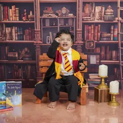 A joyful, magical moment captured in the library. His happy expression shows just how much fun these fantasy shoots can be.