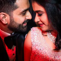 A glamorous close-up, with the red lighting adding a passionate and cinematic feel. Perfect for a cocktail or sangeet look.