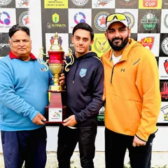 Posing with the trophy after winning the 9th Bhagwan Parshuram Open Cricket Tournament. A proud moment for me and my player.