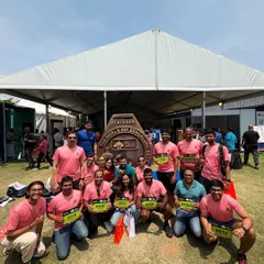 The team is all smiles at the TCS World 10K Bengaluru expo, picking up our race bibs and getting hyped for the big day.