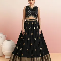 The full view of the black Pichwai lehenga, a sophisticated and unique choice for weddings and festive soirées.