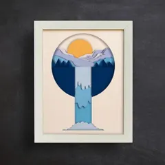 Hung on a dark wall, the light colors of the waterfall scene pop, making it a captivating piece of wall decor.