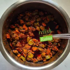 Here you can see my classic Spicy Khatti Kairi Pickle being prepared. I use Ladua kairi, a type of raw mango known for its sour taste and fleshy pulp, and mix it with my family's secret masala blend. This picture shows the pickle just after mixing, before it's left to mature and let the flavours deepen.