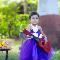 A little rockstar in the making. Using props like a toy guitar, I can create a fun, music-themed photoshoot that lets your child's personality shine.