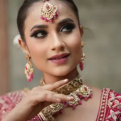 A close-up from the same photoshoot, highlighting the clean and precise makeup application.