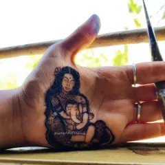 Even gods need a mother's love. This portrait of Goddess Parvati with baby Ganesha is a tribute to the universal bond between a mother and child, created for a Gowri Ganesha festival.