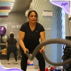 Feel the power in our kickboxing classes. A member builds her stamina and strength using battle ropes, a fantastic full-body conditioning tool we use in our sessions.