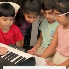 A group of curious kids gathered around a keyboard during our music workshop at Otters Club, Mumbai. This is where the first spark of musical interest often begins.