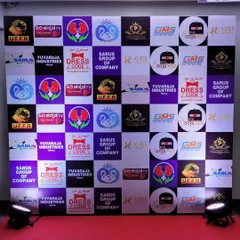 A custom-designed red carpet backdrop featuring logos of all event sponsors. This media wall is a key feature for photo opportunities at gala events.