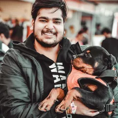 This little Rottweiler was such a sweetheart, completely relaxed in his owner's arms. Capturing this shows that even big, strong breeds have a soft and cuddly side. It was a pleasure to meet this "hottie Rottie" and his dad.