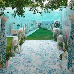 For a bride who loves high fashion, I designed a Mehendi inspired by Dior's iconic patterns. This entrance features custom-painted animal sculptures, setting the stage for a chic, couture-themed afternoon.
