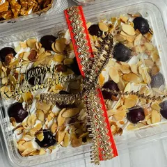 A close-up of my Cherry Almond Tres Leches tub, decorated for Rakhi. It’s a sweet and fruity delight, perfect for celebrating with your sibling.
