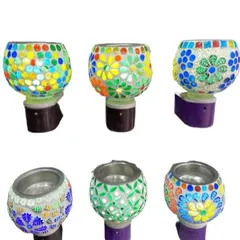 Explore our vibrant collection of plug-in mosaic aroma lamps. Each one has a unique, handcrafted design and color combination, serving as both a beautiful night light and a fragrance diffuser for any room in your home.