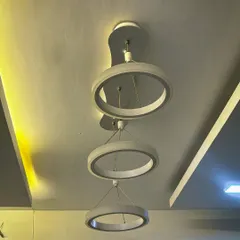 This shot highlights the warm and cool light tones of the modern ring fixture. I can help you choose and install lighting that matches the mood you want to create in your home.