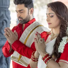 A moment of prayer and togetherness. This beautiful shot captures the serene and spiritual side of a couple's journey.