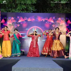 We also cover school functions and corporate events. This photo captures a group of young performers on stage during a cultural fiesta, showcasing their coordinated effort and colorful costumes.
