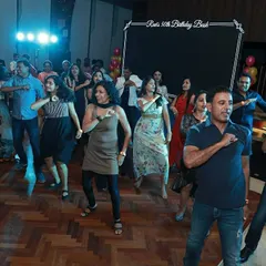 The start of a surprise flash mob for a 50th birthday party. I love getting a whole group of non-dancers in on the secret and choreographing a routine that gets everyone on the dance floor.