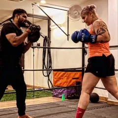 In the ring, it's just you, me, and the goal. I focus on every detail of your form, making sure each punch you throw is stronger and sharper than the last. This is one-on-one coaching at its most intense.