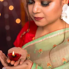 A close up shot demonstrating how to use a simple prop like a diya as a key light source. This is a practical lighting technique we cover to help students create evocative and professional looking images.