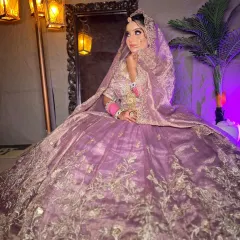 Another view of the lavender ball-gown lehenga, showing the delicate details on the dupatta and blouse.