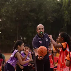 A referee gets the game started with a jump ball in the U-11 division. It's amazing to see the competitive spirit in our youngest players.