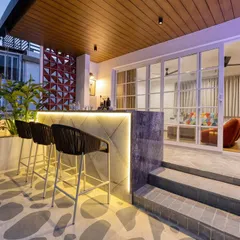 Another angle of the Villa 17 rooftop bar, showing the detailed tile work, under-counter lighting, and seamless transition from the indoor space to the outdoor terrace.