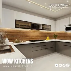 This angle highlights the seamless sink and countertop area, along with the smoked glass upper cabinets that add depth and display space without creating clutter.