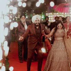 The celebration begins the moment you walk in. This shot captures the pure energy and happiness of a couple making their entrance at their engagement party.