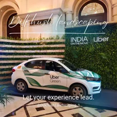 An "Uber Green" electric vehicle displayed in front of a custom living wall we created for the launch event. The installation provides a lush, on-brand photo opportunity.