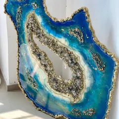 A stunning, large-scale geode mirror in vibrant shades of blue and turquoise, with a sparkling crystal and gold leaf center. This is one of my favorite blue pieces.