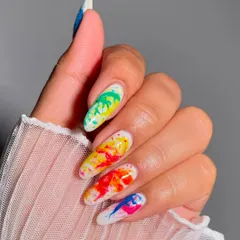 Celebrate Holi with a splash of color on your nails! This vibrant watercolor splash design is the perfect way to get into the festive spirit.
