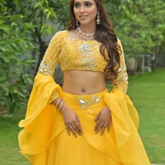 Another shot of the yellow Haldi lehenga, highlighting the embellished blouse and modern silhouette.