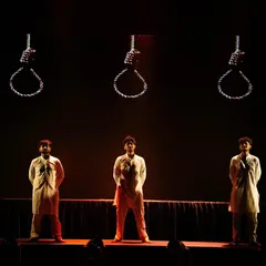 This dramatic tableau from "Inquilab" uses stark lighting and powerful symbolism to create a memorable stage picture. It showcases our ability to craft intense, thought-provoking moments within a larger performance.