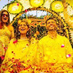 The pure joy and fun of a Haldi ceremony, as the couple is showered with flower petals by their friends and family. We aim to capture the high energy and candid laughter of these moments.